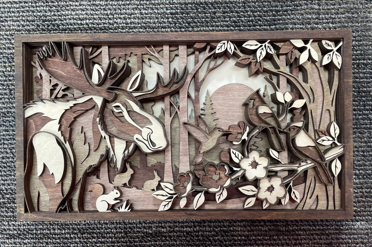 Handcrafted Moose in Forest Scene